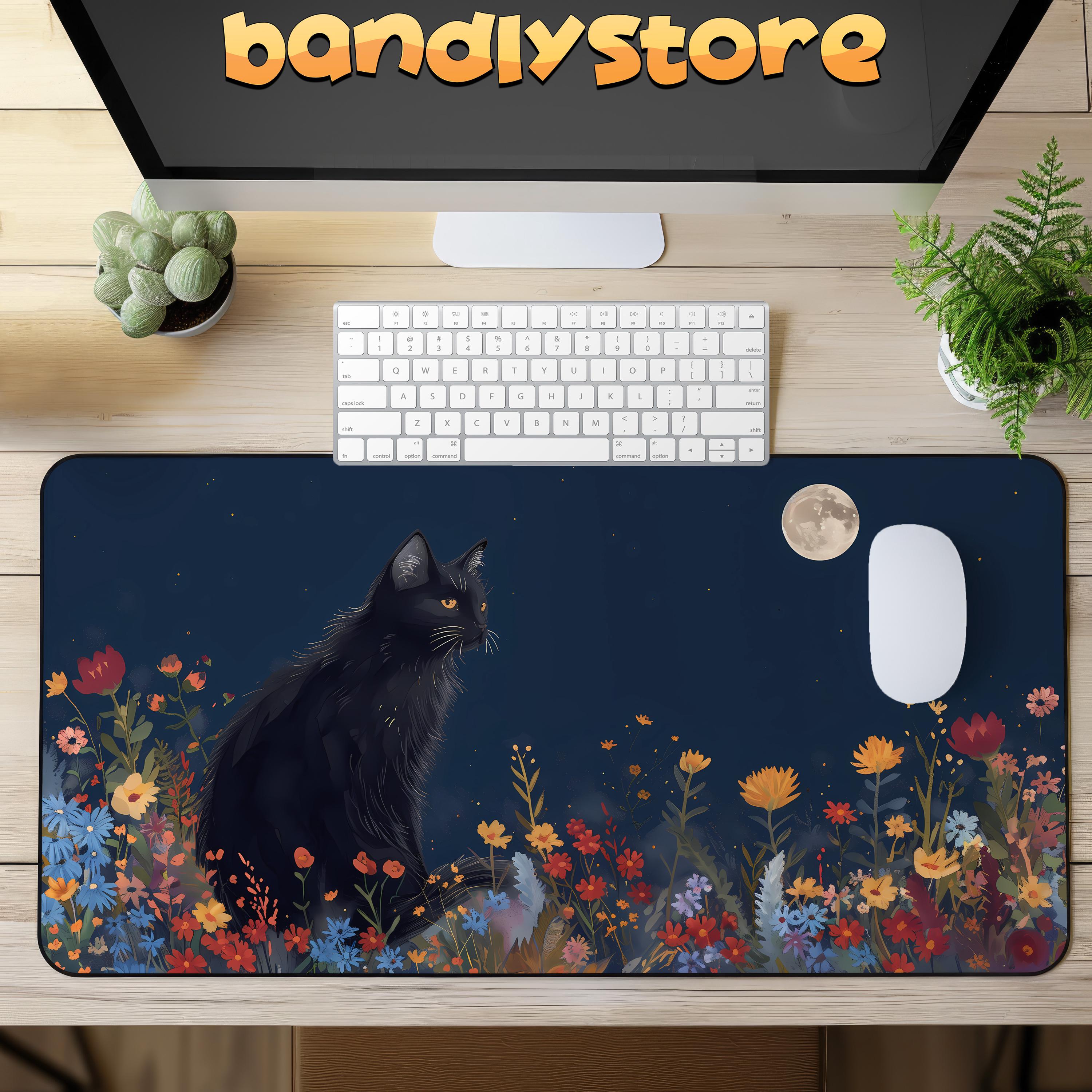Black Cat And The Moon Desk Mat on a desk with keyboard and mouse