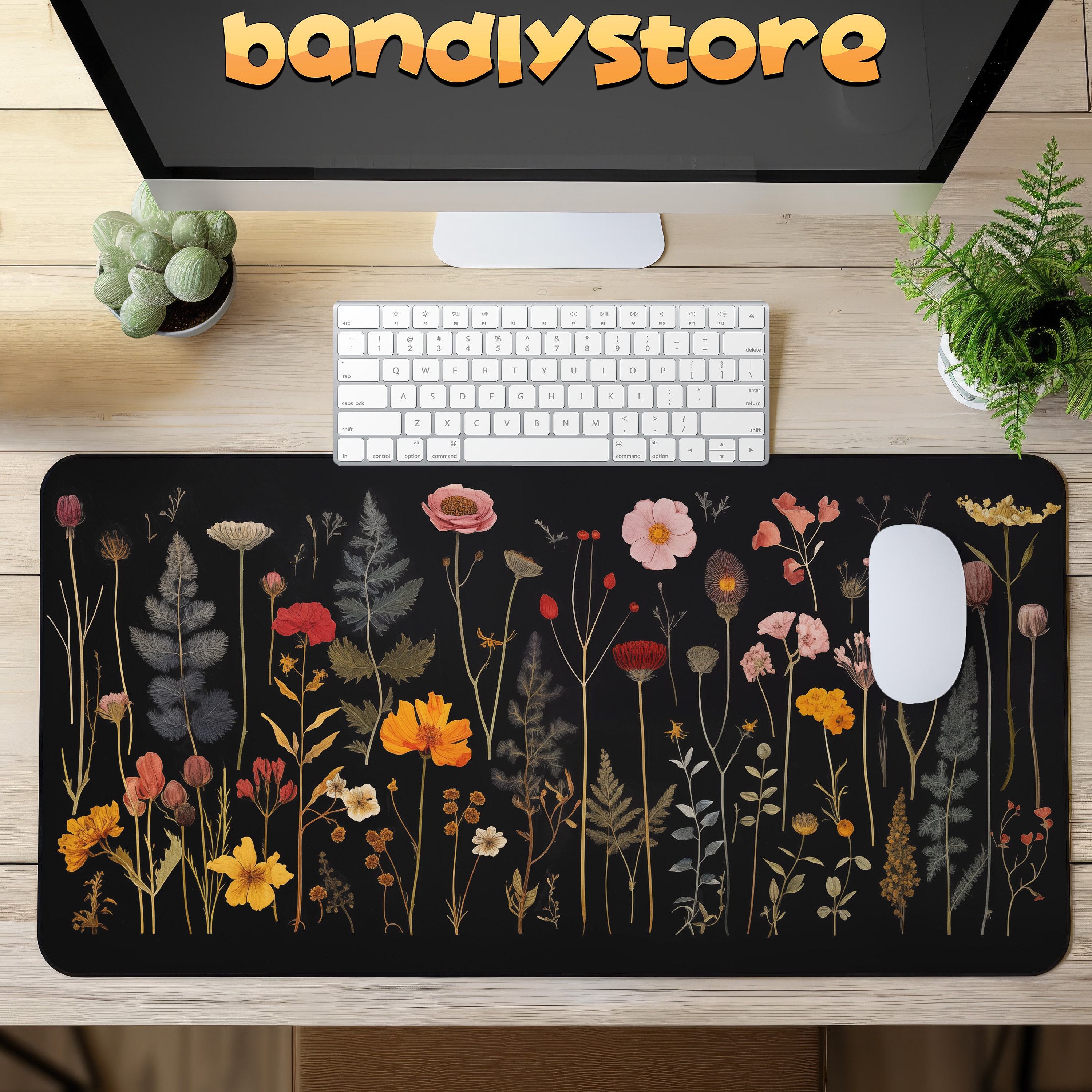 Pressed Wildflowers Black Floral Desk Mat on a desk with keyboard and mouse