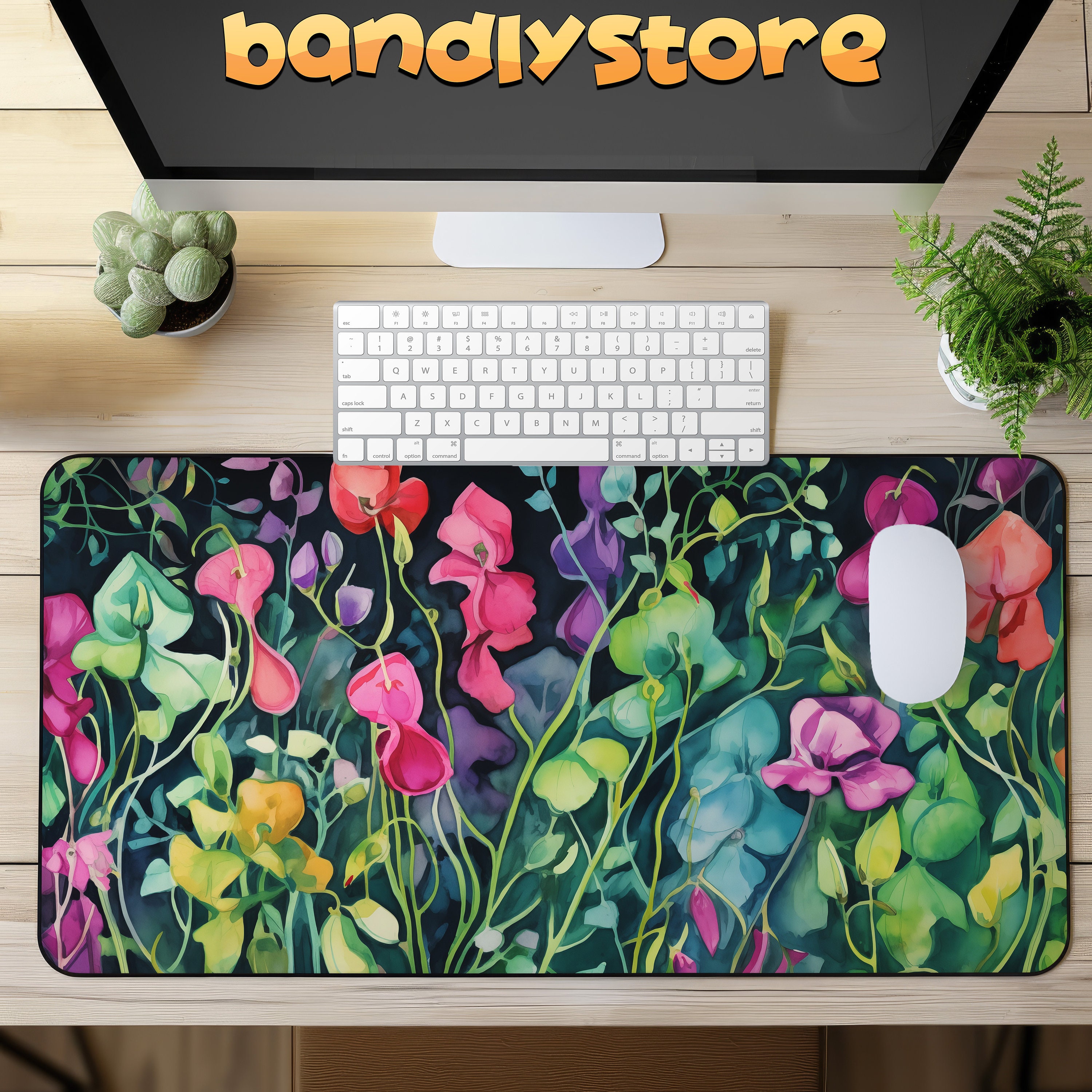 Watercolor Sweet Pea Flowers Desk Mat on a desk with keyboard and mouse